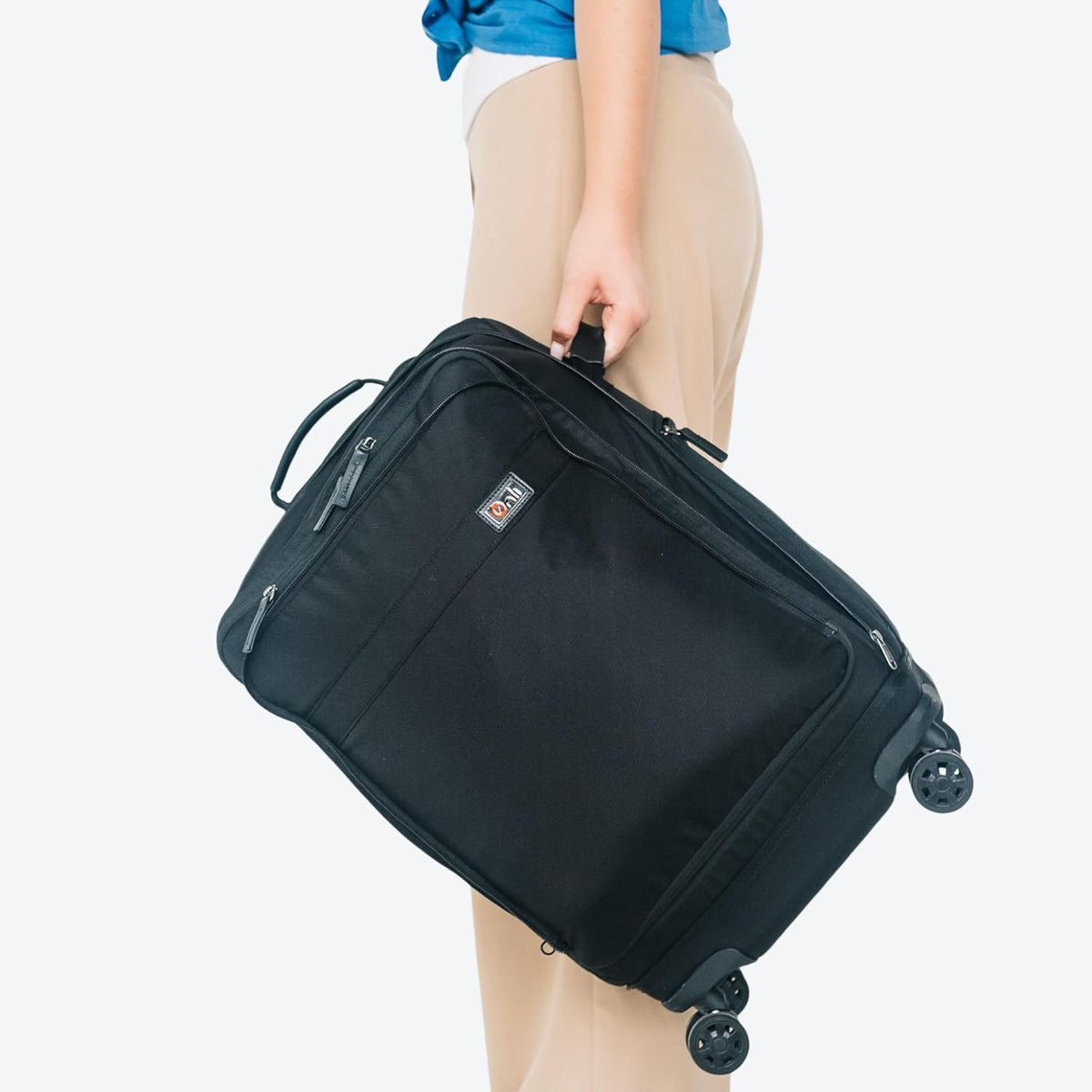 Trilogy Expandable Spinner (Black): Fits under-seat on most airplanes. Two convenient side pockets! Expandable, with solid base for strength and stability. 4-wheel design glides through airports!