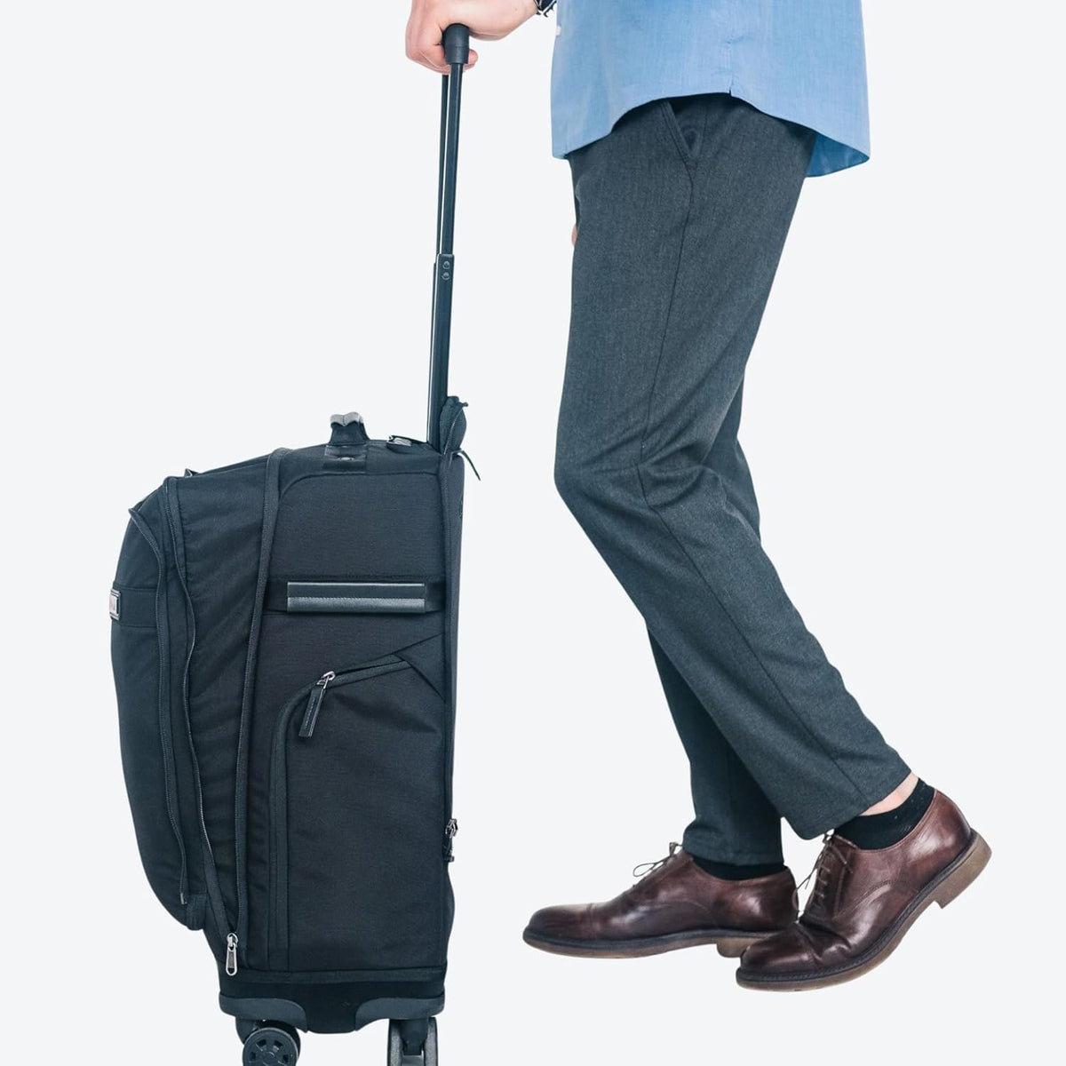 Trilogy Expandable Spinner (Black): Fits under-seat on most airplanes. Two convenient side pockets! Expandable, with solid base for strength and stability. 4-wheel design glides through airports!