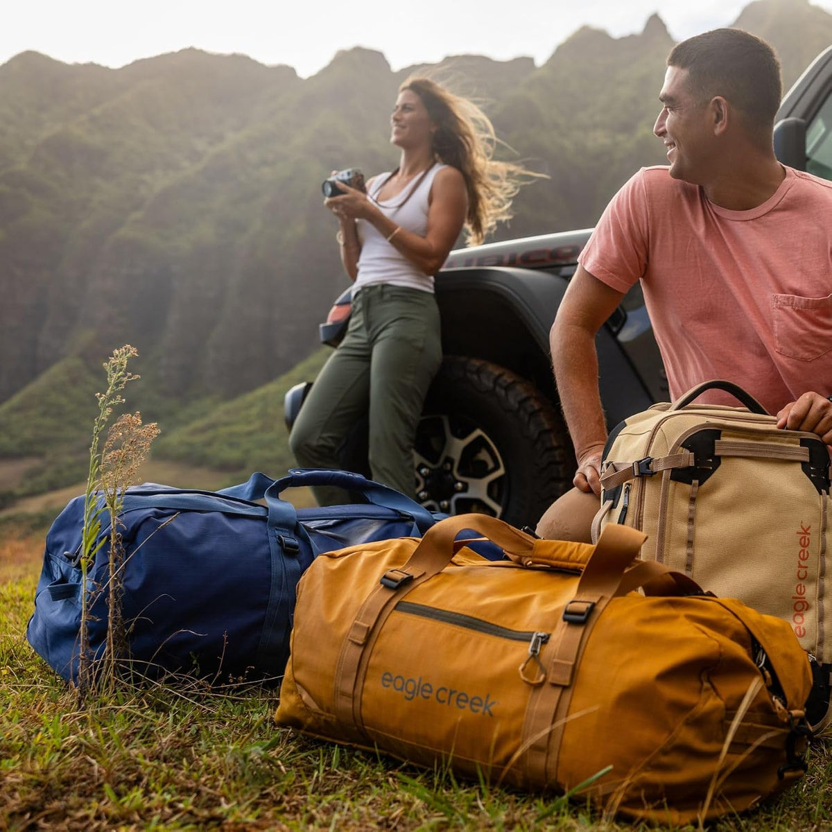 No Matter What Rolling Duffel - Durable Rolling Bag for Travel - Adjustable Shoulder Strap - Heavy Duty Wheels - Lockable Zippers - Multiple Carry Options - 130L - Smoke